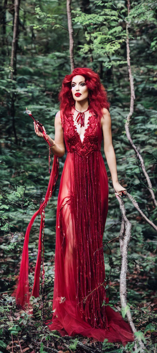 Vibrant red-haired woman in flowing red dress in mystical forest scene