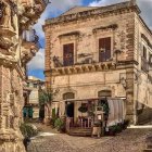 Mediterranean-style Street with Cobblestones and Orange Building