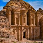 Intricate carvings on sandstone facade in Petra, Jordan