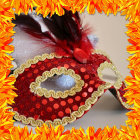 Colorful masquerade masks with gem embellishments and vibrant feathers.