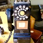 Vintage Rotary Dial Telephone Against Autumn Leaves Background