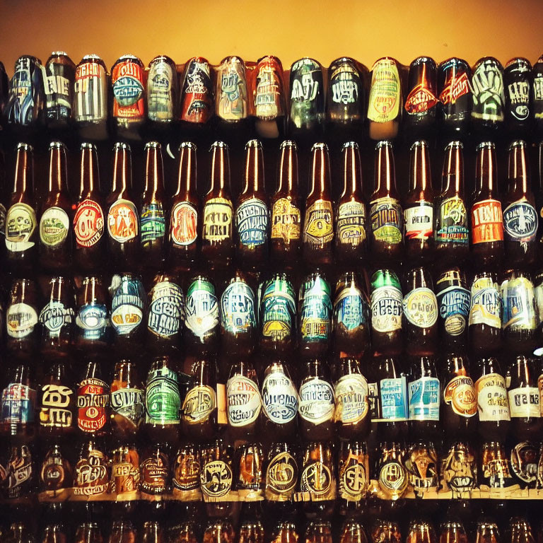 Craft beer bottles with unique labels on warm-toned shelves