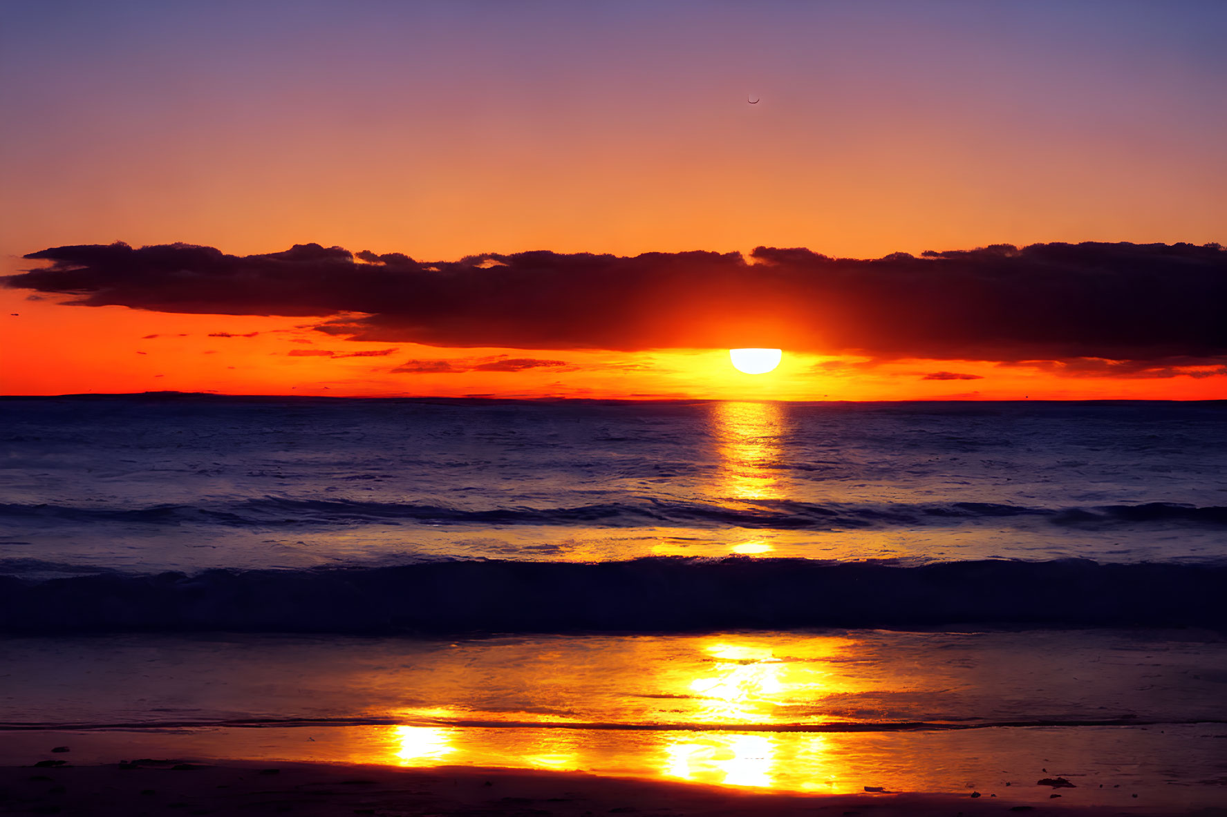 Vibrant ocean sunset with orange sun and crescent moon in twilight