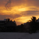 Vivid warm colors in sunset landscape with two suns, reflecting on water.