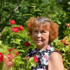 Detailed artwork of woman with floral headdress in lush garden.