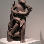 Interwoven sculpture of two figures in dynamic pose