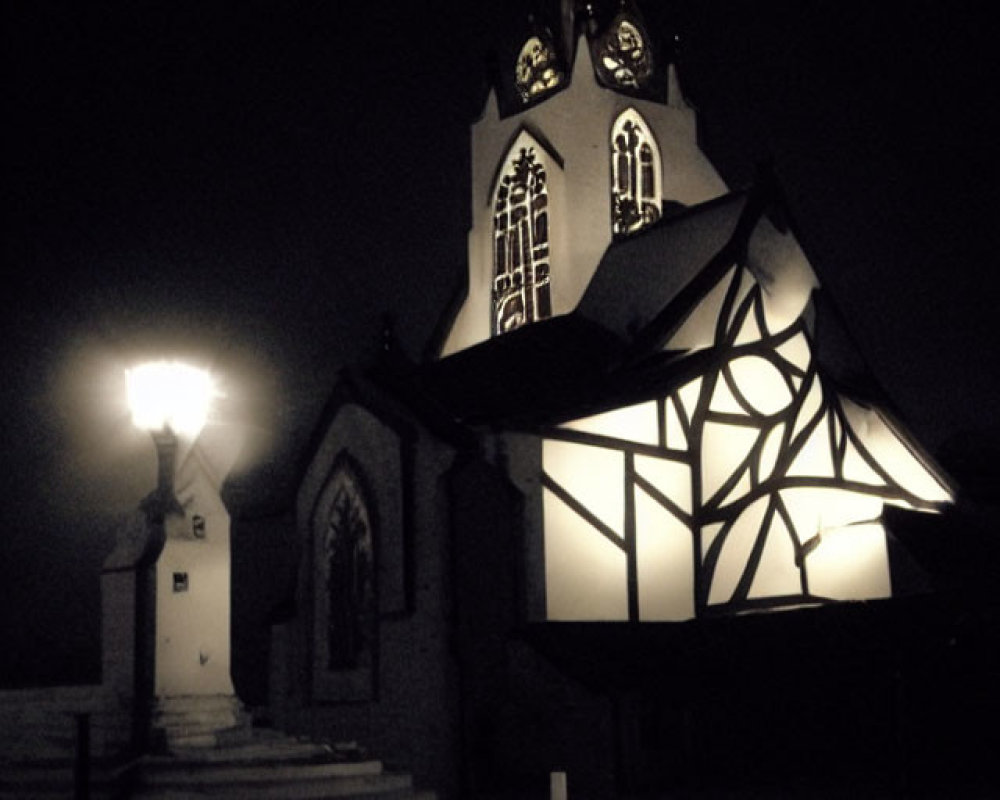 Dimly Lit Church at Night with Glowing Cross and Stained-Glass Windows