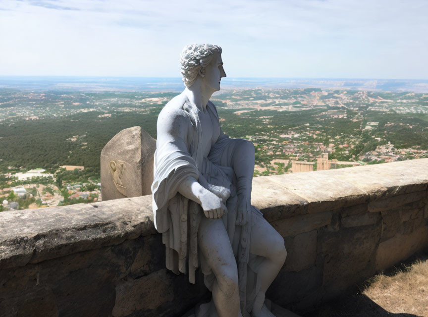 Seated marble statue with panoramic view from high point