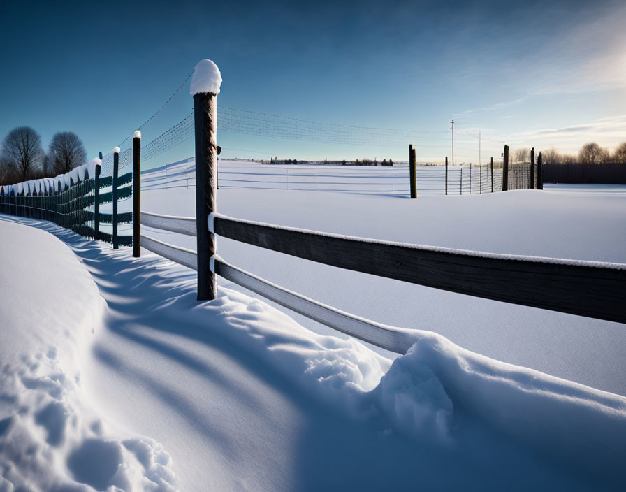 Snow-covered black fence in serene winter scene