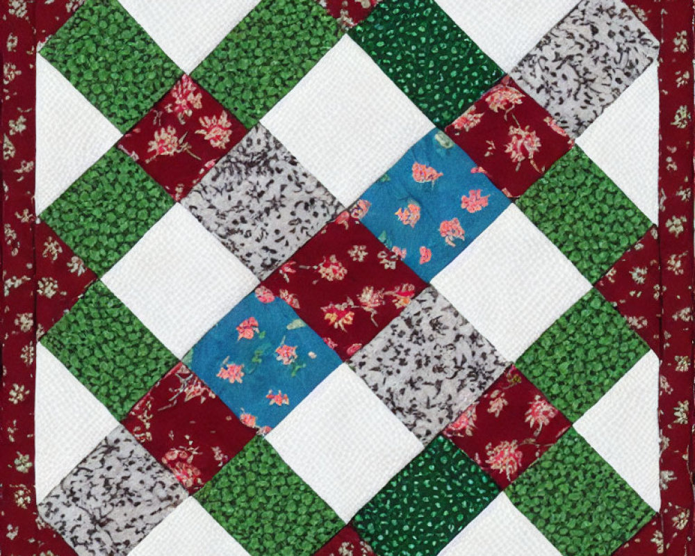 Symmetrical floral and solid patchwork quilt square in green, red, blue, and white