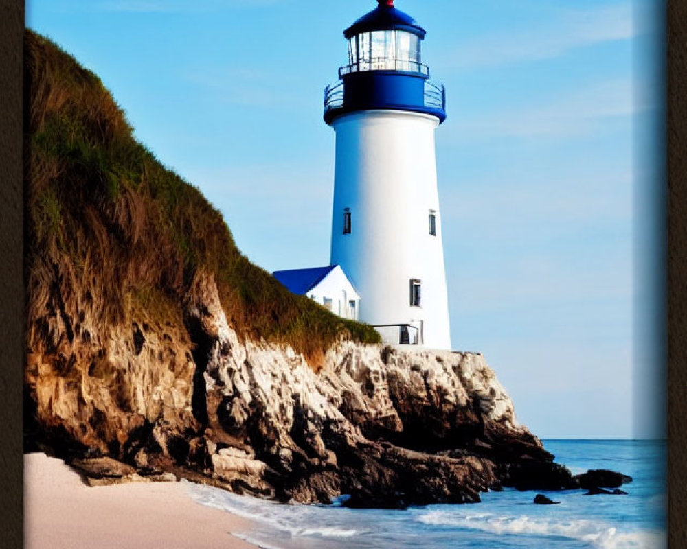 White lighthouse with red cap on rocky cliff overlooking serene beach and calm ocean.