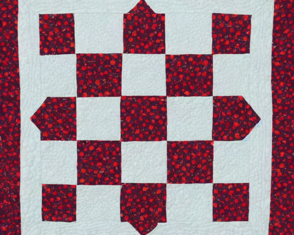 Handmade red and white geometric quilt on floral background