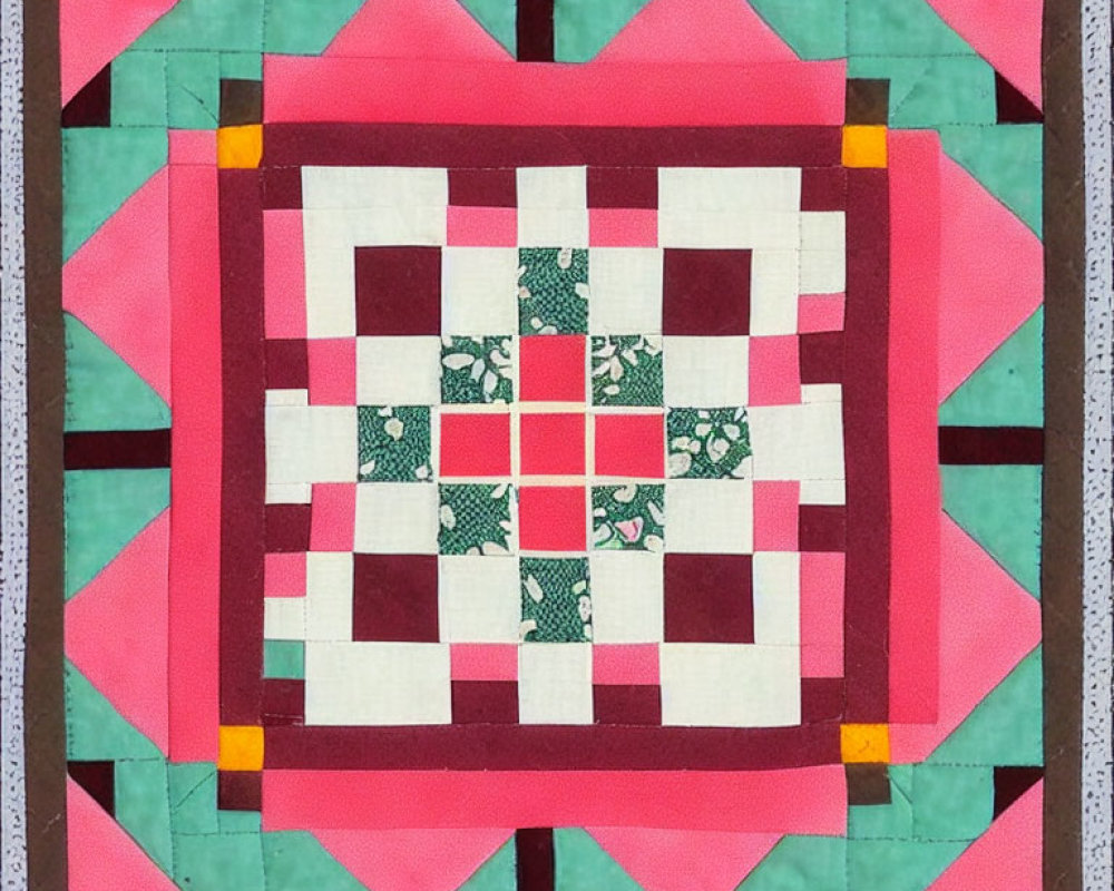 Geometric pink, green, white, and yellow quilt square design