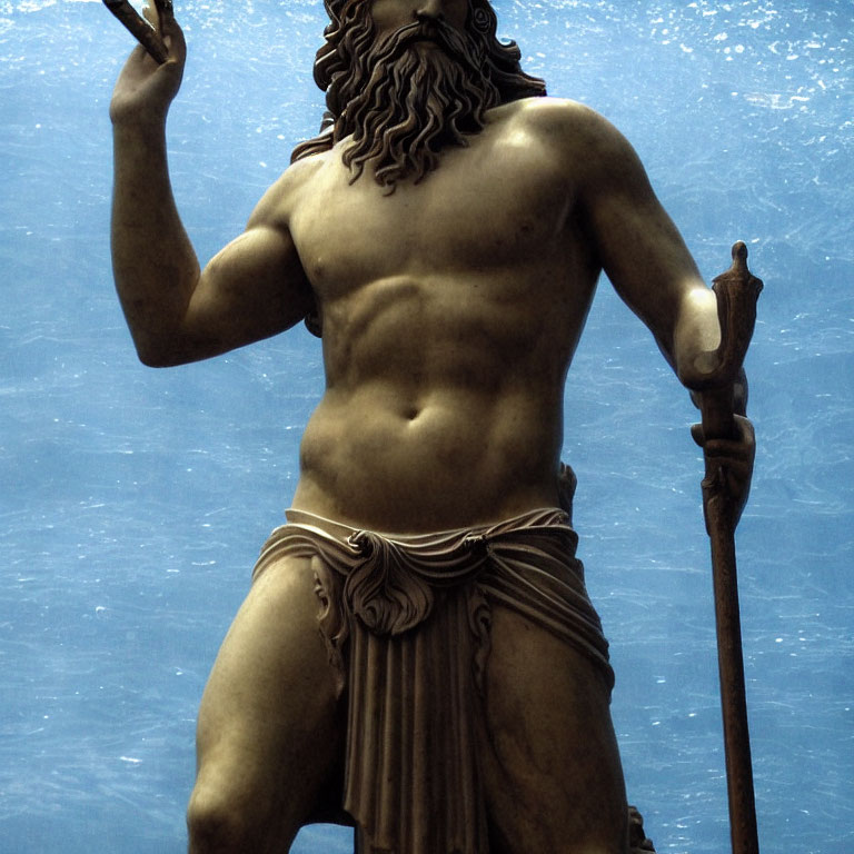 Muscular bearded male bronze statue with staff, gesturing against blue background