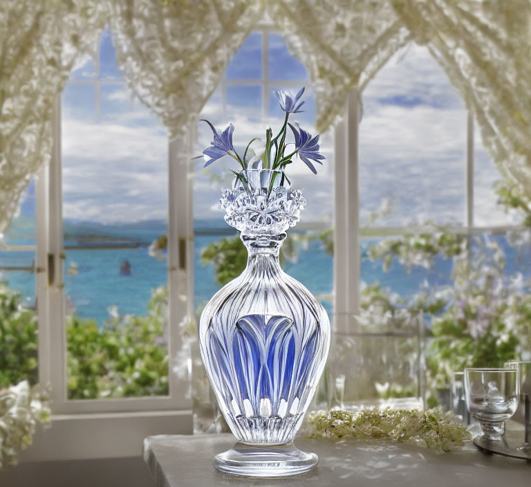 Blue Floral Design Crystal Vase with Purple Flowers on Table by Open Window