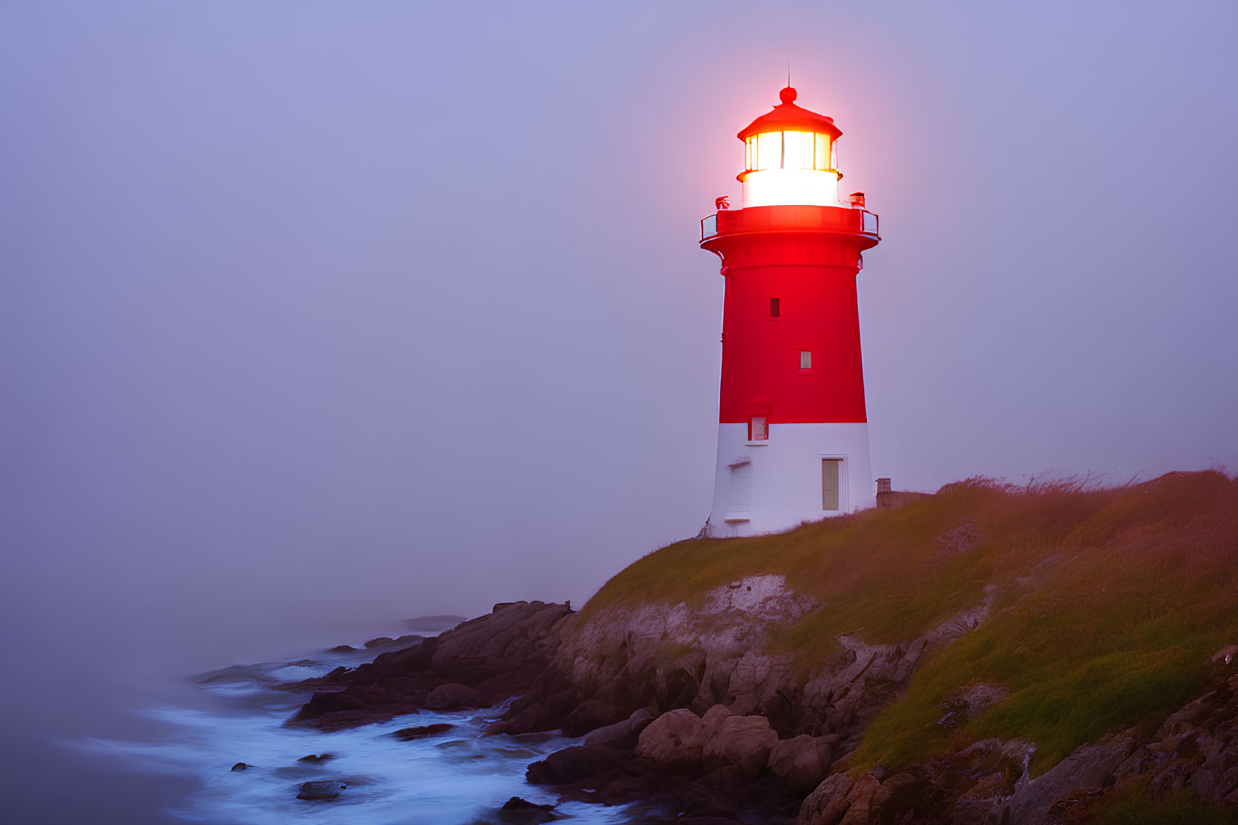 Red and White Lighthouse on Rocky Cliffs at Twilight