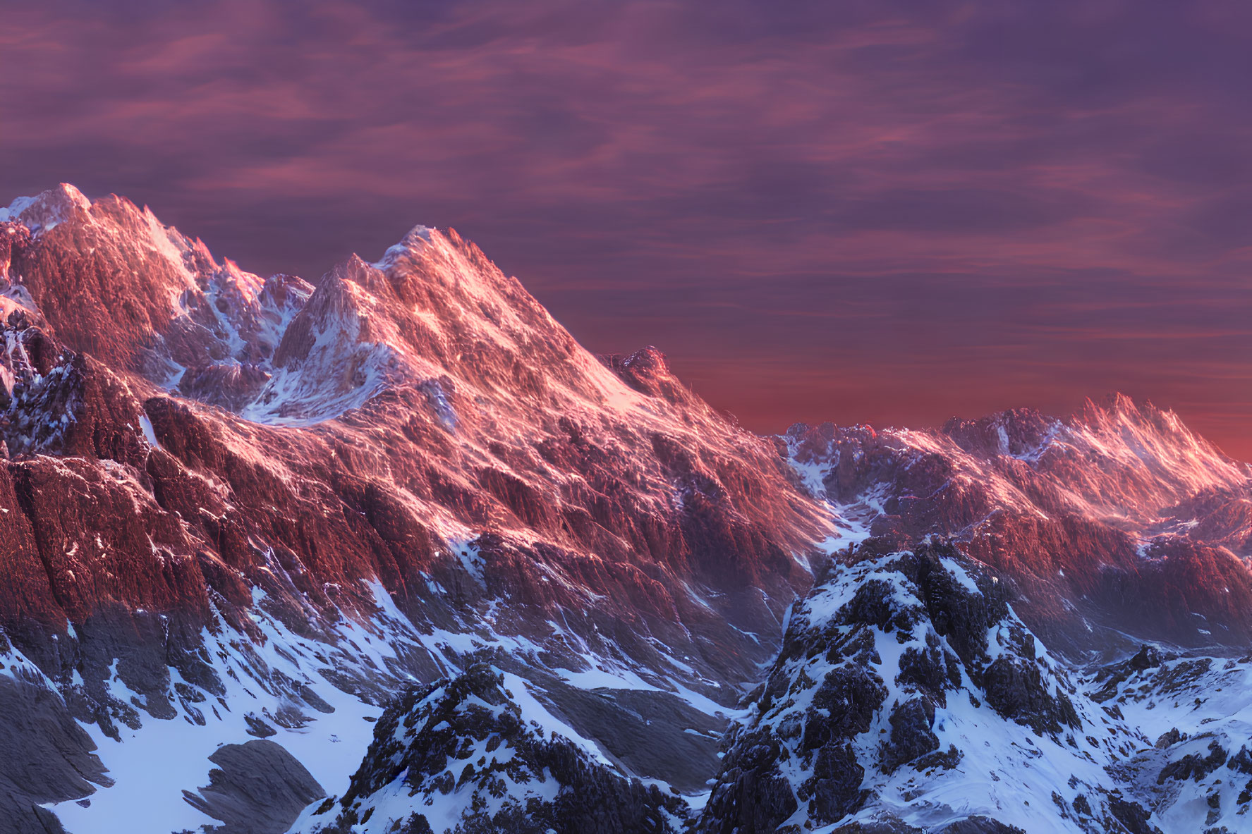 Snow-capped mountains under pink and purple sunset sky