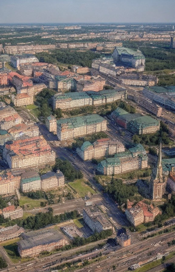 Urban area with buildings, church spire, roads, and greenery