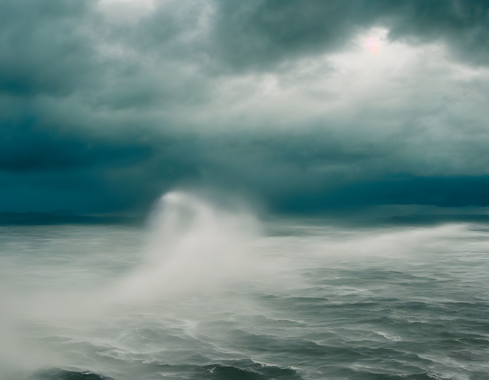 Stormy Sea Under Dark Clouds with Sun and Powerful Wave Spray