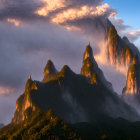 Misty mountain peaks in fiery sunset or sunrise light