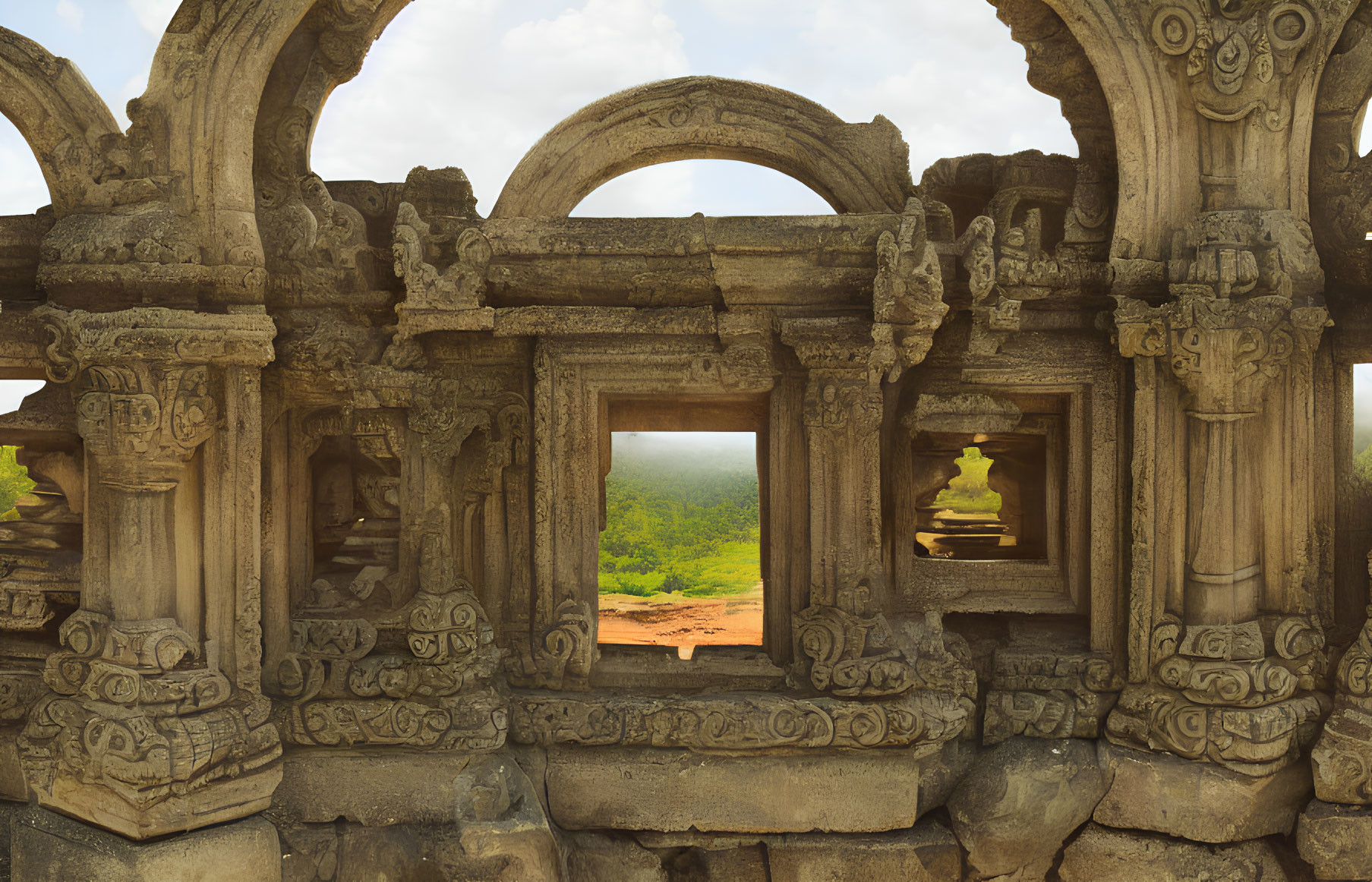 Ancient temple stone arches with traditional motifs and scenic landscape view