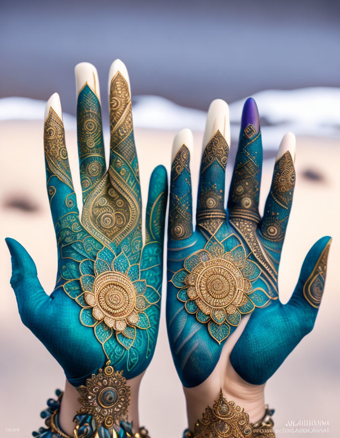 Intricate Blue and Gold Henna Butterfly Hands Art