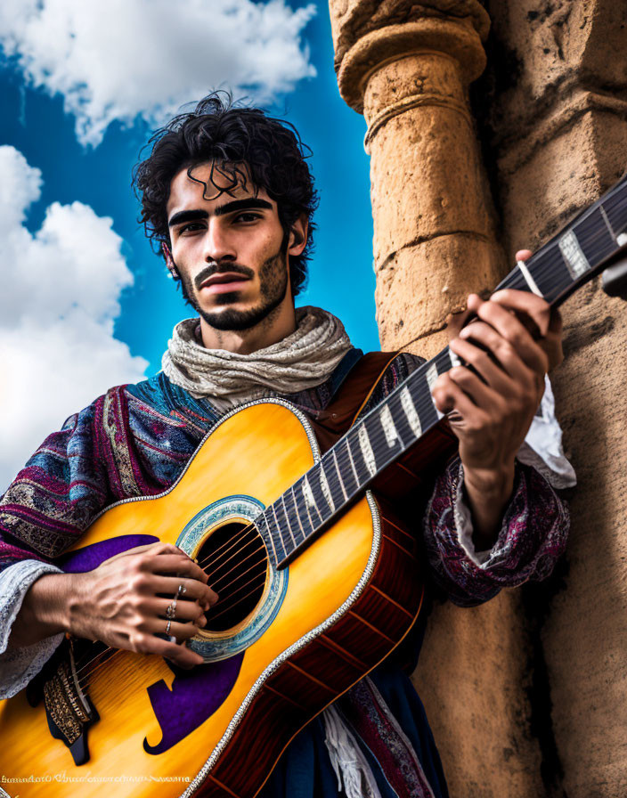 Curly-Haired Man Playing Guitar Outdoors in Traditional Attire