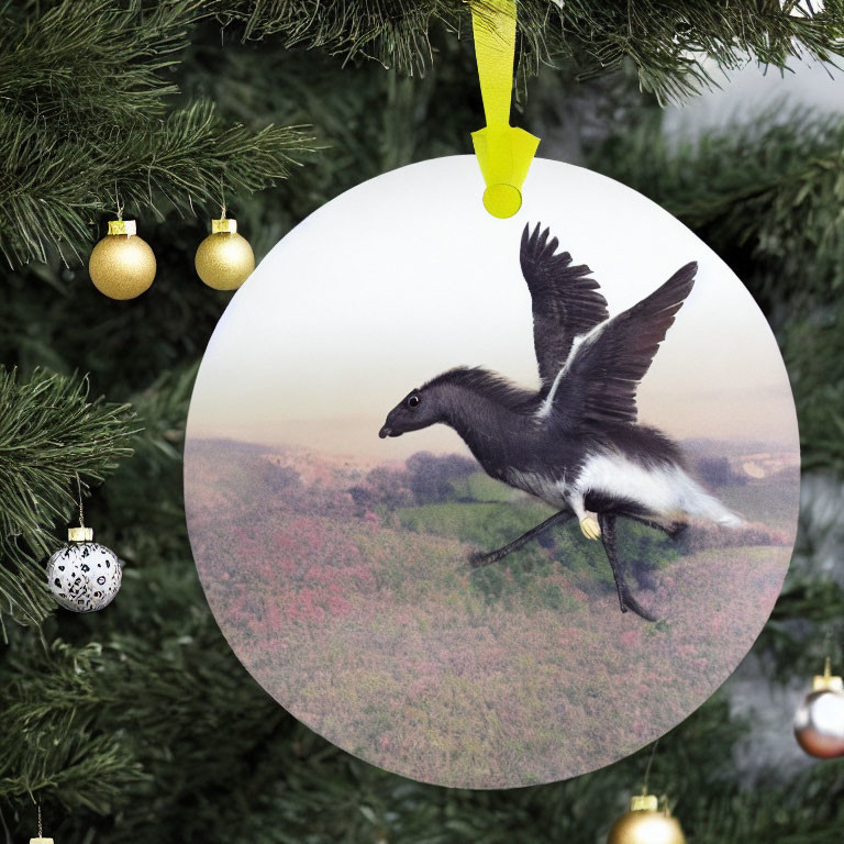 Circular Christmas ornament with flying goose and gold baubles