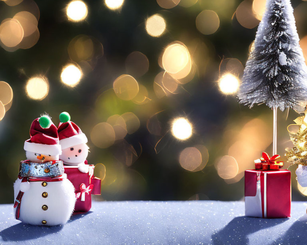 Snowmen Figurines with Christmas Tree and Gifts in Sparkling Bokeh Light