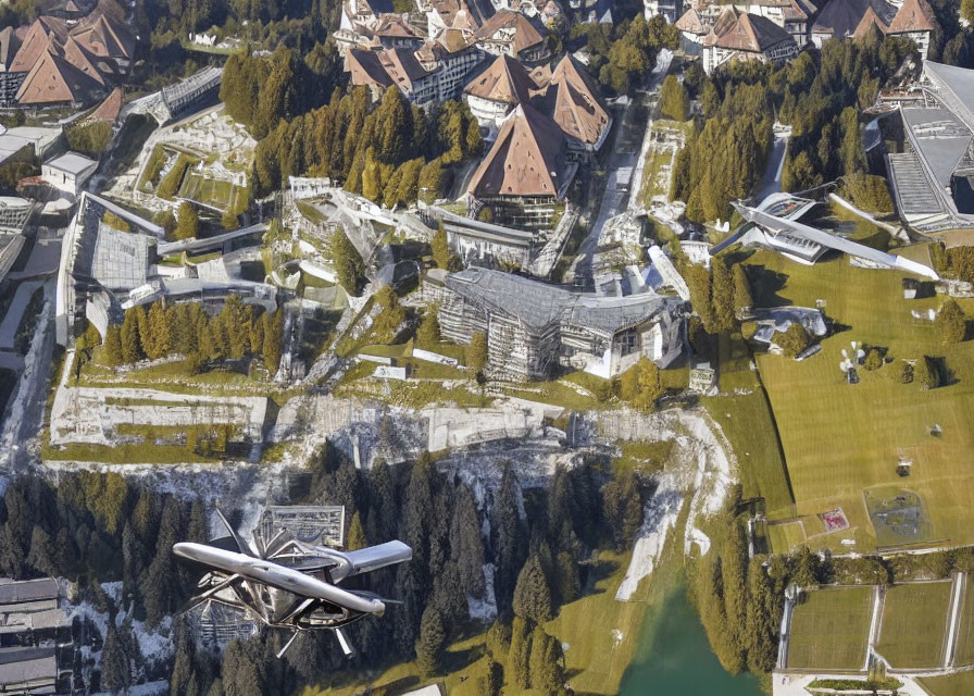 Scenic village with traditional buildings and greenery from aerial view