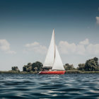 Sailboat painting: Serene scene with vibrant colors and dramatic sky