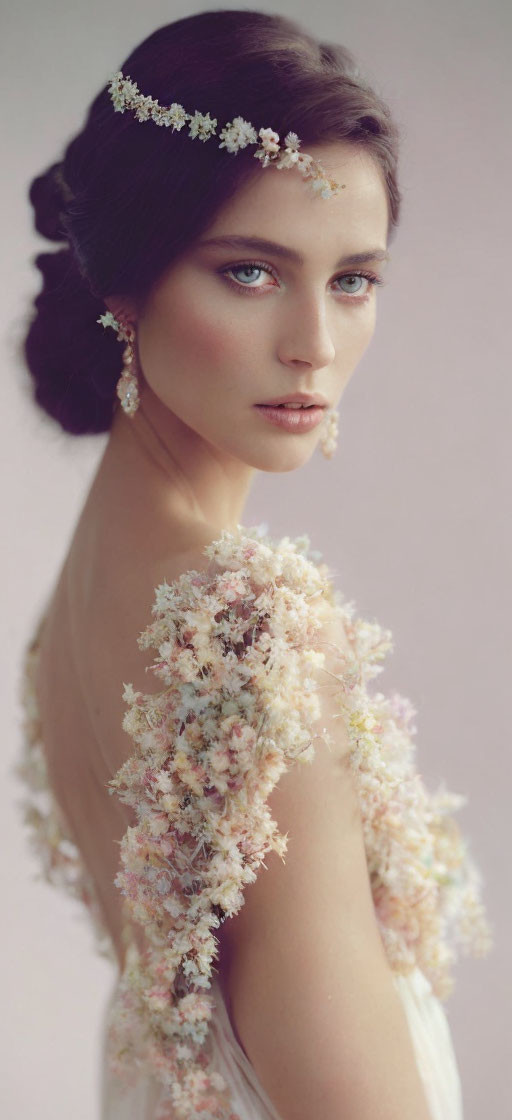 Woman with Floral Decorations in Hair and Shoulders: Serene and Romantic Look