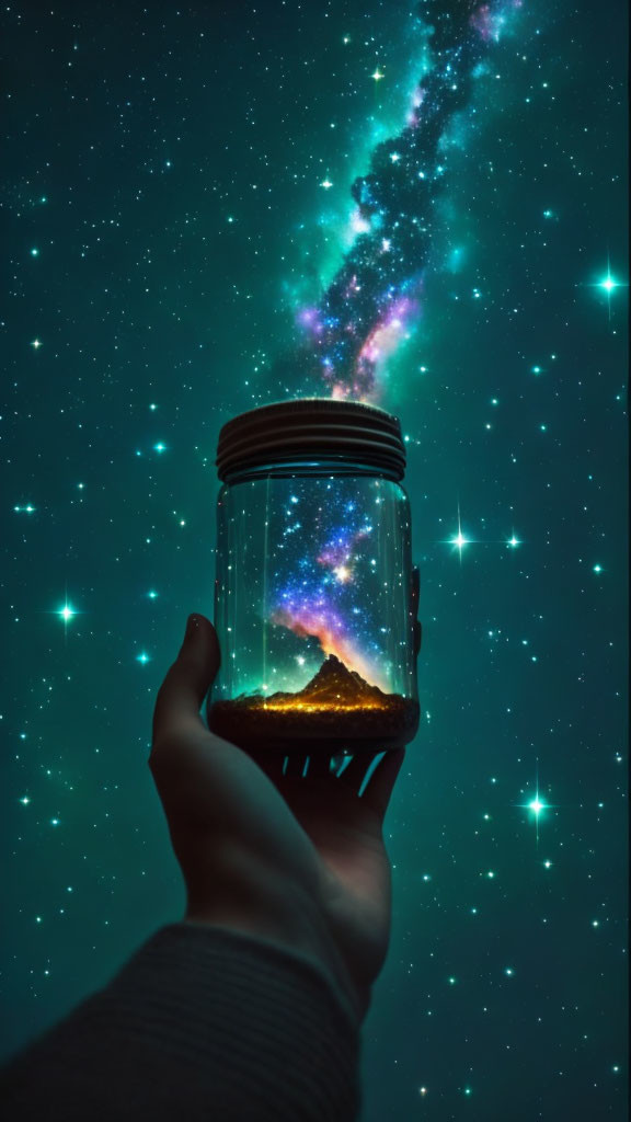 Hand holding jar with miniature mountain under starry sky and galaxy-like formation.