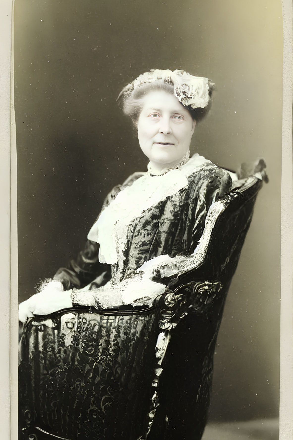 Vintage Portrait of Smiling Woman in Ornate Dress and Hat