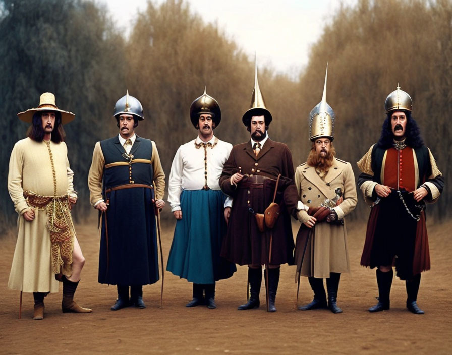 Seven men in historical European military uniforms with helmets and swords in misty forest.