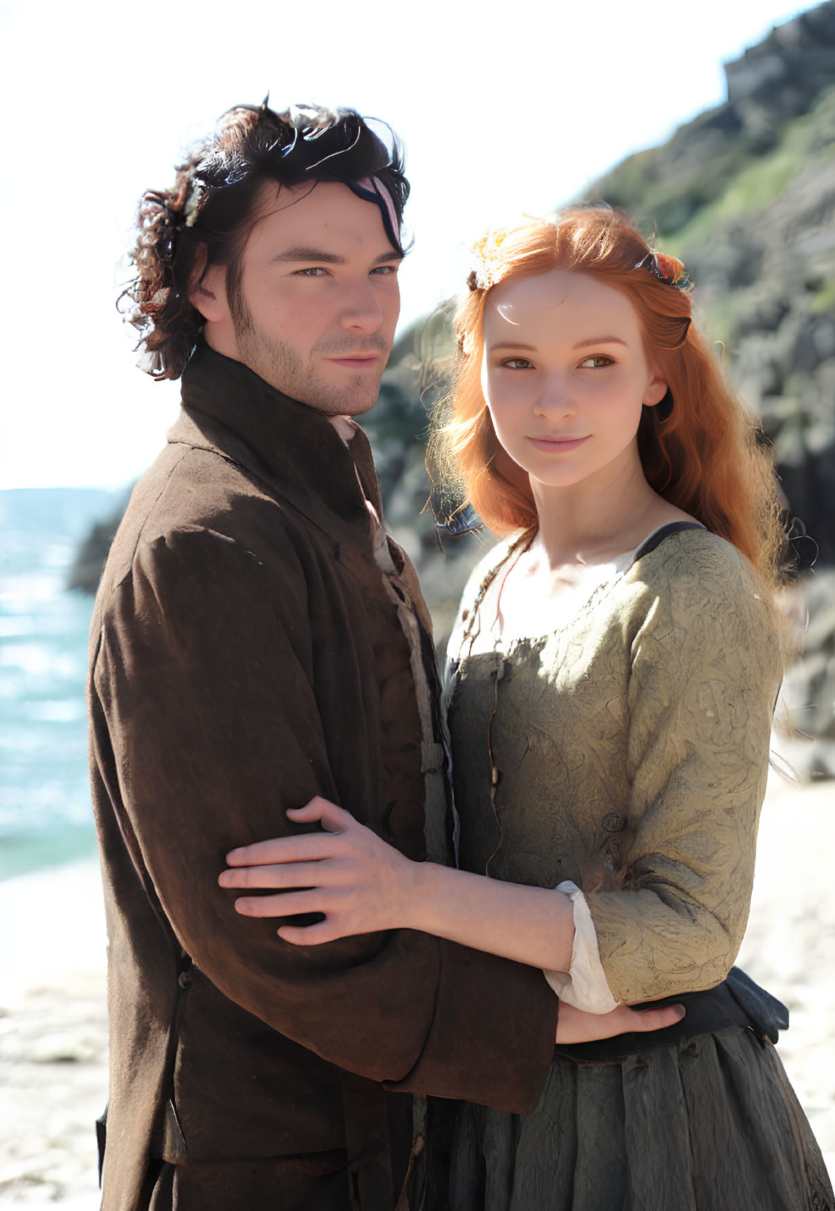 Historical clothing couple embracing on sunny beach with rocks