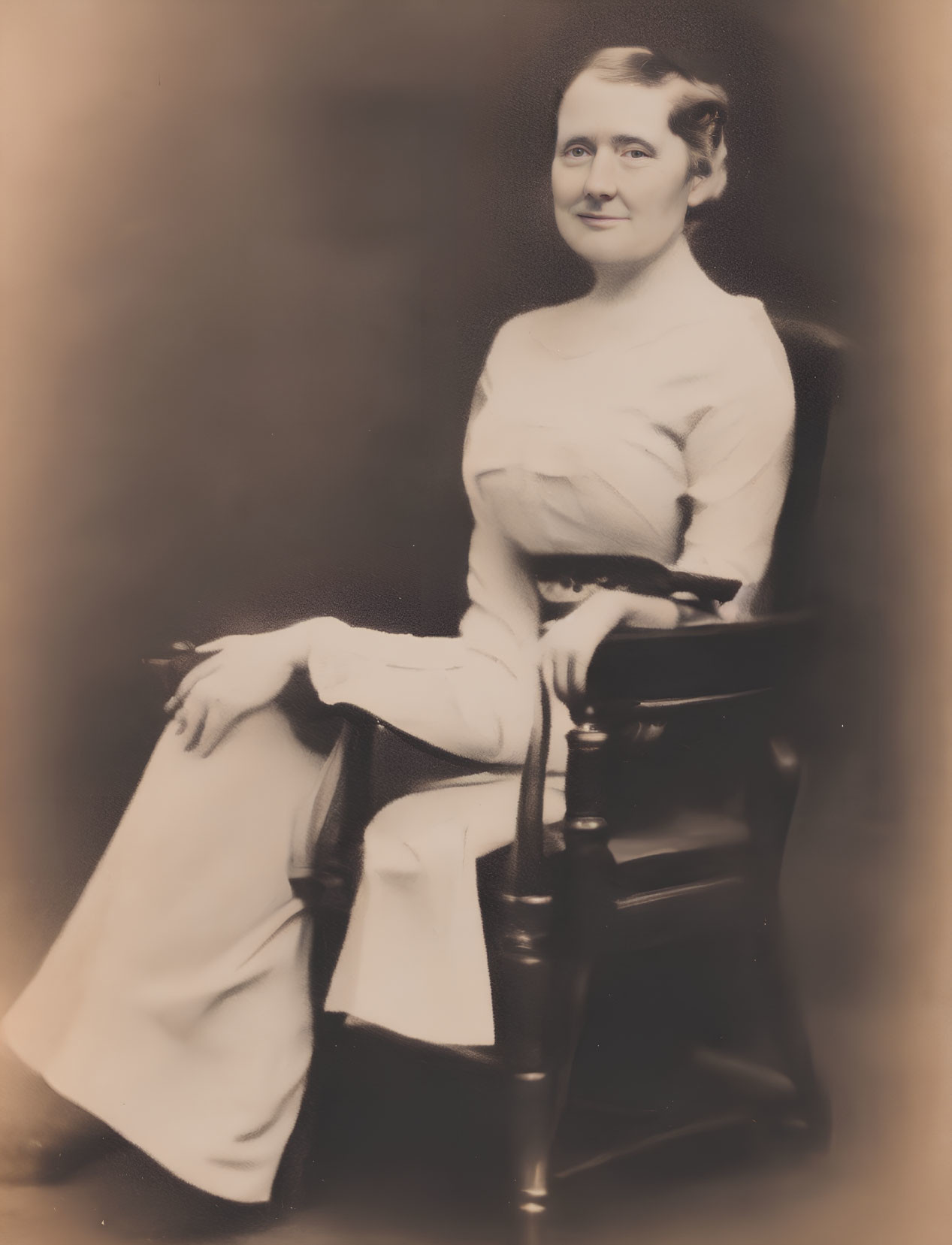 Sepia-Toned Portrait of Smiling Woman in White Dress