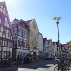 Traditional European street scene with half-timbered houses and flower boxes.