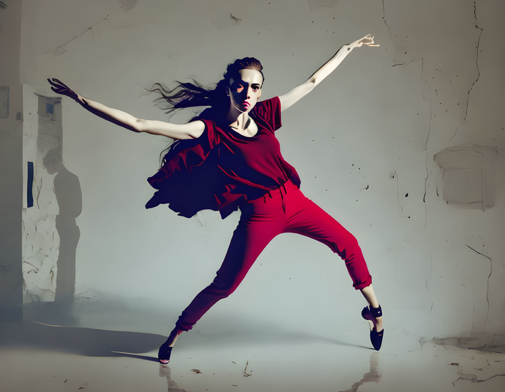 Vibrant red outfit dancer in expressive pose with shadowy figure