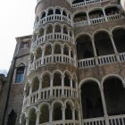 Surreal black and white architectural structure with intricate staircases and arches